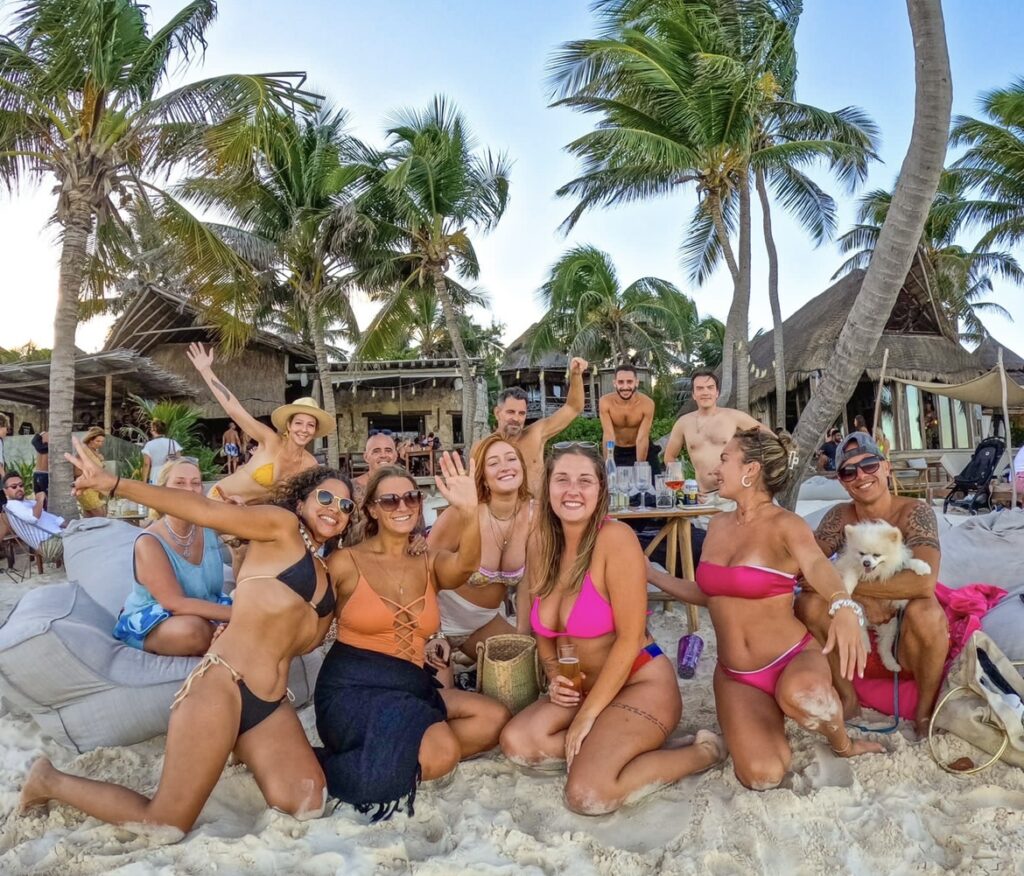 Aly and her friends on the beach all smiling